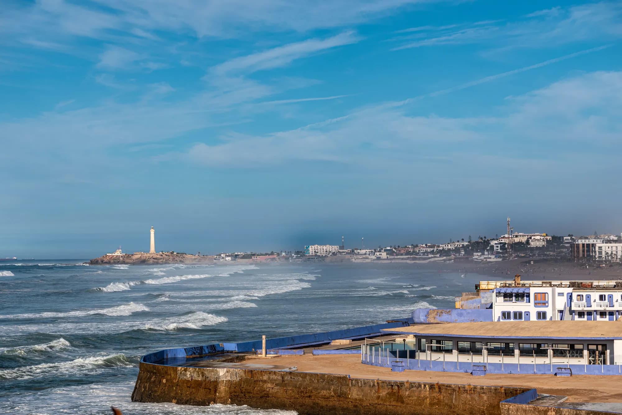The lighthouse and Atlantic coastline along Casablanca's corniche, Morocco